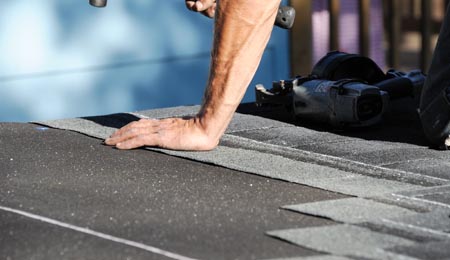 Man Installing a Roof